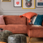 wall panelling behind sofa with plump soft cushions
